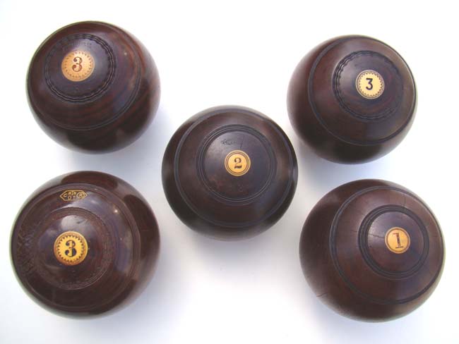 A collection of five Antique English Lignum Vitae Lawn Bowling Balls circa 1890-1920 — image 3
